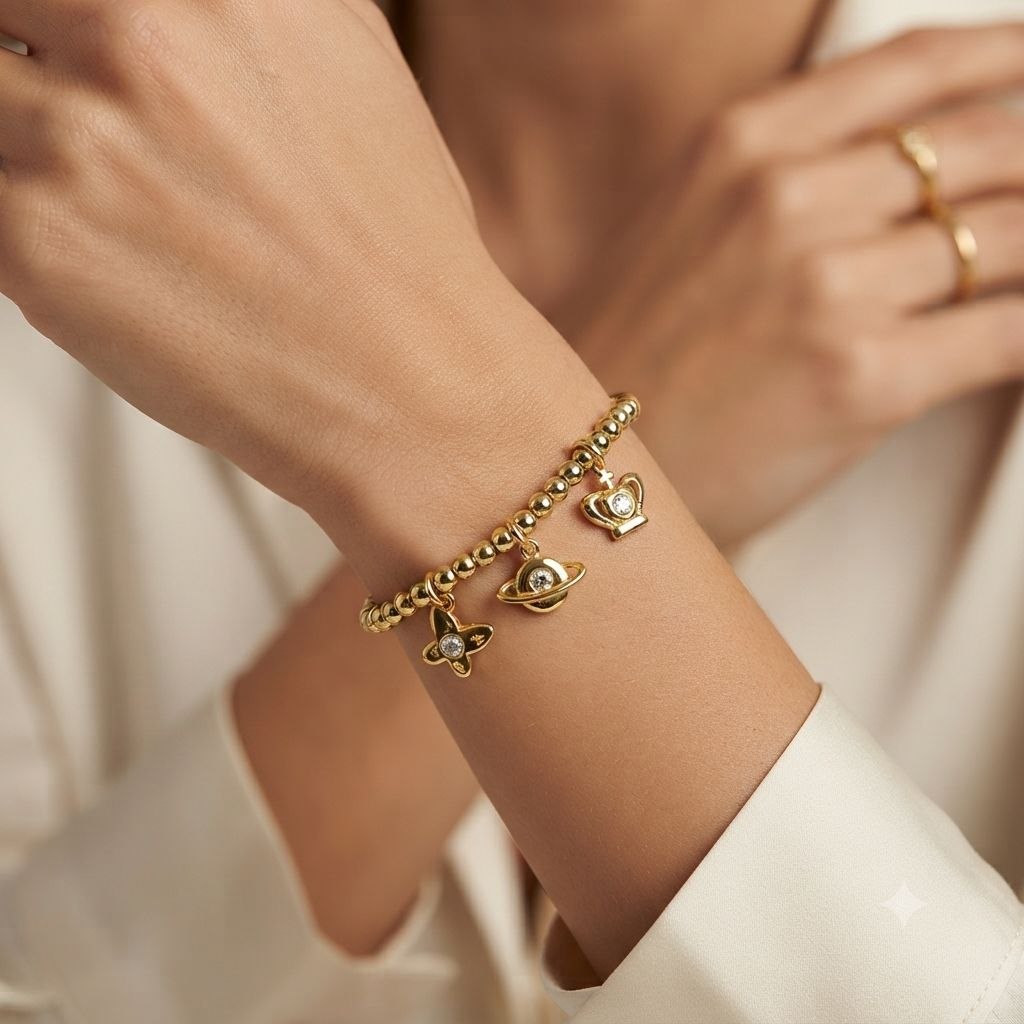 PULSERA DE ENCHAPE PARA DAMA CON DISEÑO DE MARIPOSA, PLANTA Y CORONA