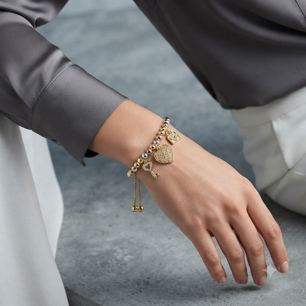 PULSERA DE ENCHAPE PARA DAMA CON DISEÑO DE LLAVE, CORAZON Y CANDADO