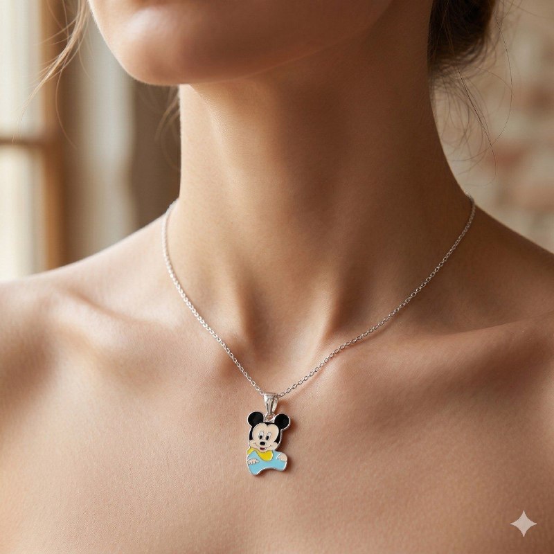 DIJE EN FORMA DE MICKEY MOUSE DE PLATA 9.25 PESO: 3G