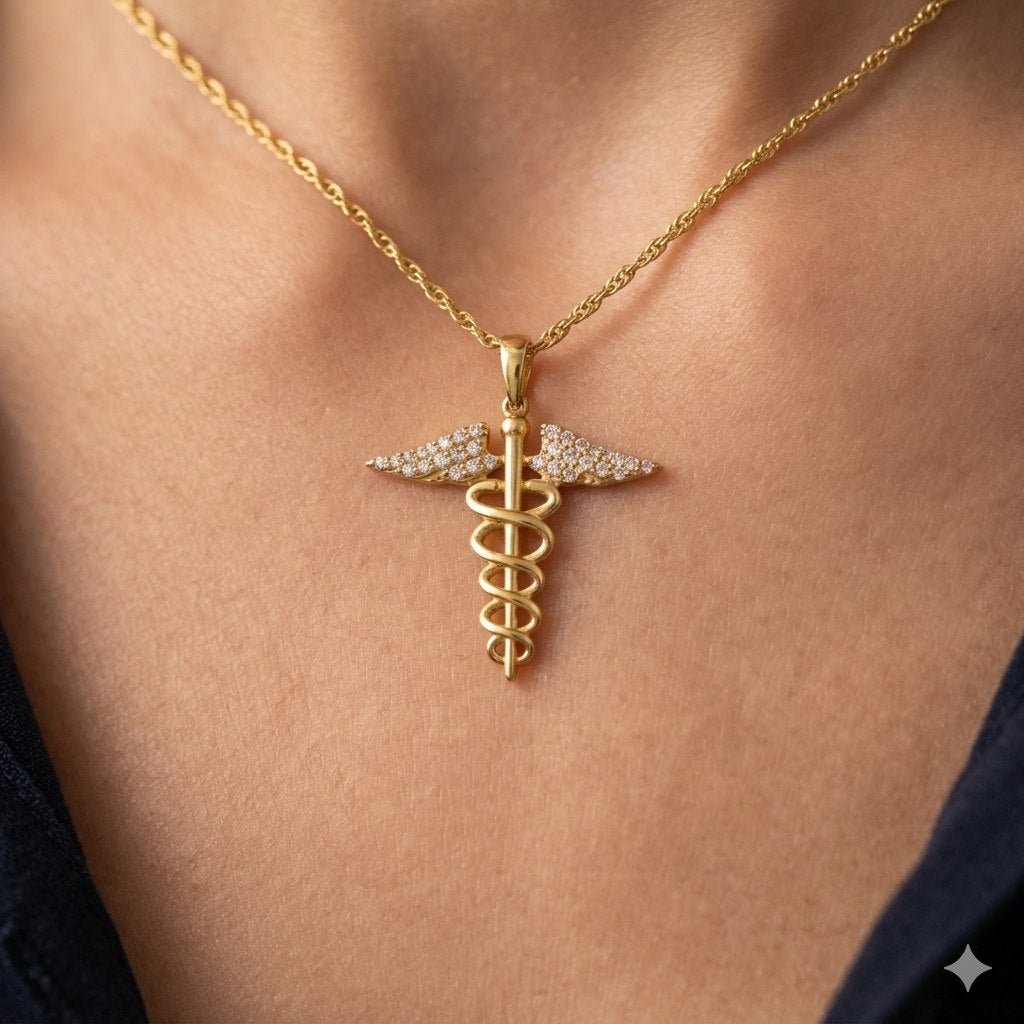 DIJE DE ORO 10K CON FORMA DE CADUCEO DE HERMES 2CM PESO: 1.2G