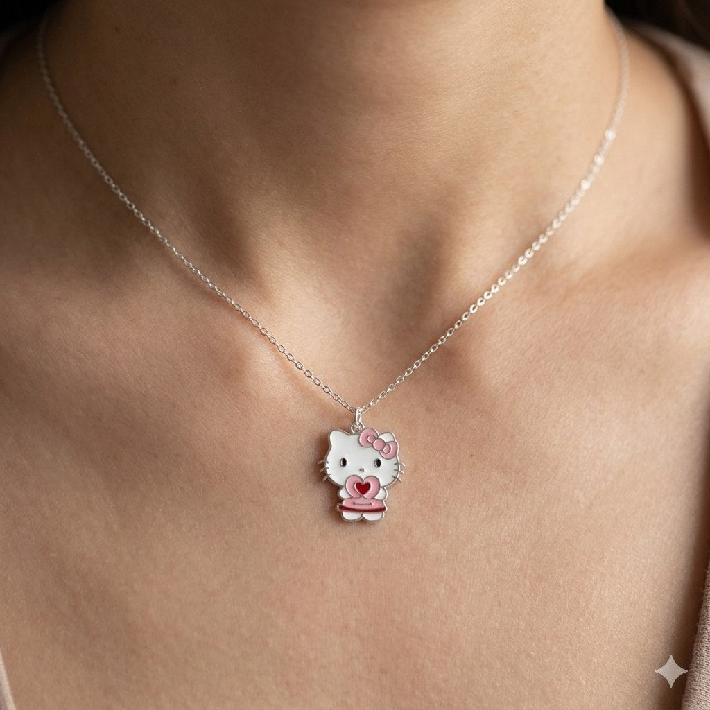 DIJE DE PLATA 9.25 EN FORMA DE HELLO KITTY CON CORAZON ROSA 25CM PESO: 3.9G
