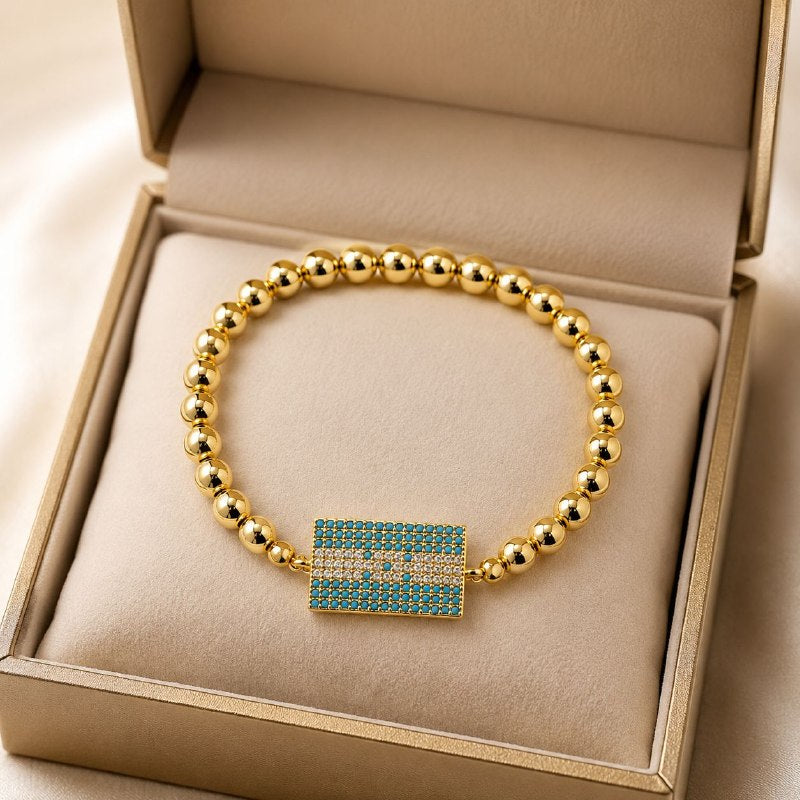 PULSERA DE ENCHAPE ELASTICA PARA DAMA CON DISEÑO DE HONDURAS