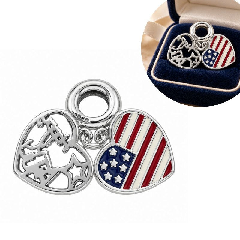 CHARM DE PLATA 9.25 CON DISEÑO DE BANDERA DE ESTADOS UNIDOS EN FORMA DE CORAZON MEDIDA: 2CM PESO: 3.2G